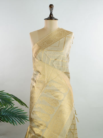 tissue This Kora Semi Tissue saree in rich gold features elegant stripes woven with fine zari. Lightweight and luminous, it captures the essence of festive finesse. Crafted in Varanasi, it drapes with ease and radiance. A timeless choice for celebrations with subtle grandeur. #KoraSemiTissue #GoldStripes #FineZari #VaranasiWeaves #ManoranjithamSarees Vasanti - Gold Semi Silk Saree - Manoranjitham Weaves - Handloom Store