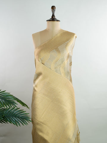 tissue This Kora Semi Tissue saree in rich gold features elegant stripes woven with fine zari. Lightweight and luminous, it captures the essence of festive finesse. Crafted in Varanasi, it drapes with ease and radiance. A timeless choice for celebrations with subtle grandeur. #KoraSemiTissue #GoldStripes #FineZari #VaranasiWeaves #ManoranjithamSarees Yashoda - Gold Semi Silk Saree - Manoranjitham Weaves - Handloom Store