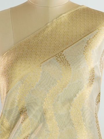 tissue This Kora Semi Tissue saree in rich gold features elegant stripes woven with fine zari. Lightweight and luminous, it captures the essence of festive finesse. Crafted in Varanasi, it drapes with ease and radiance. A timeless choice for celebrations with subtle grandeur. #KoraSemiTissue #GoldStripes #FineZari #VaranasiWeaves #ManoranjithamSarees Jeevitha - Manoranjitham Weaves - Handloom Store