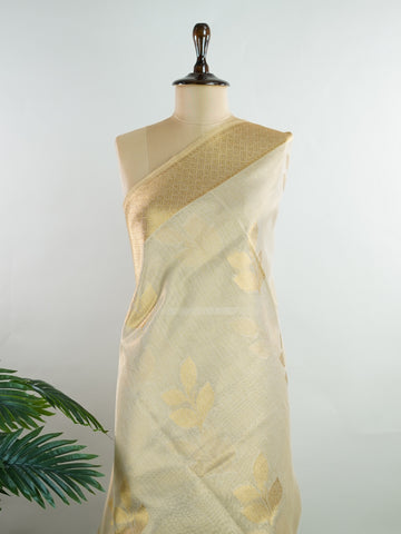 tissue This Kora Semi Tissue saree in rich gold features elegant stripes woven with fine zari. Lightweight and luminous, it captures the essence of festive finesse. Crafted in Varanasi, it drapes with ease and radiance. A timeless choice for celebrations with subtle grandeur. #KoraSemiTissue #GoldStripes #FineZari #VaranasiWeaves #ManoranjithamSarees Rajeswari - Gold Semi Silk Saree - Manoranjitham Weaves - Handloom Store