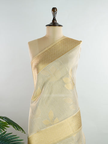 tissue This Kora Semi Tissue saree in rich gold features elegant stripes woven with fine zari. Lightweight and luminous, it captures the essence of festive finesse. Crafted in Varanasi, it drapes with ease and radiance. A timeless choice for celebrations with subtle grandeur. #KoraSemiTissue #GoldStripes #FineZari #VaranasiWeaves #ManoranjithamSarees Rajeswari - Gold Semi Silk Saree - Manoranjitham Weaves - Handloom Store