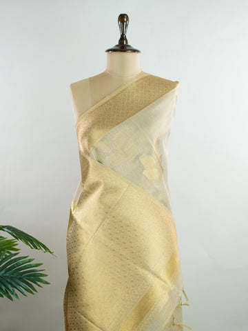 tissue This Kora Semi Tissue saree in rich gold features elegant stripes woven with fine zari. Lightweight and luminous, it captures the essence of festive finesse. Crafted in Varanasi, it drapes with ease and radiance. A timeless choice for celebrations with subtle grandeur. #KoraSemiTissue #GoldStripes #FineZari #VaranasiWeaves #ManoranjithamSarees Rajeswari - Gold Semi Silk Saree - Manoranjitham Weaves - Handloom Store