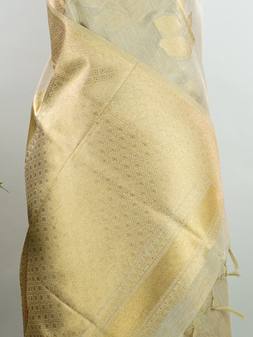 tissue This Kora Semi Tissue saree in rich gold features elegant stripes woven with fine zari. Lightweight and luminous, it captures the essence of festive finesse. Crafted in Varanasi, it drapes with ease and radiance. A timeless choice for celebrations with subtle grandeur. #KoraSemiTissue #GoldStripes #FineZari #VaranasiWeaves #ManoranjithamSarees Bhuvaneshwari - Gold Semi Silk Saree - Manoranjitham Weaves - Handloom Store