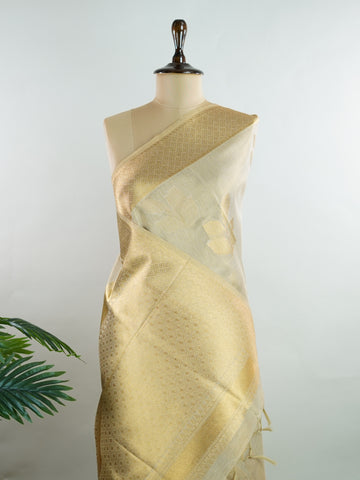 tissue This Kora Semi Tissue saree in rich gold features elegant stripes woven with fine zari. Lightweight and luminous, it captures the essence of festive finesse. Crafted in Varanasi, it drapes with ease and radiance. A timeless choice for celebrations with subtle grandeur. #KoraSemiTissue #GoldStripes #FineZari #VaranasiWeaves #ManoranjithamSarees Bhuvaneshwari - Gold Semi Silk Saree - Manoranjitham Weaves - Handloom Store