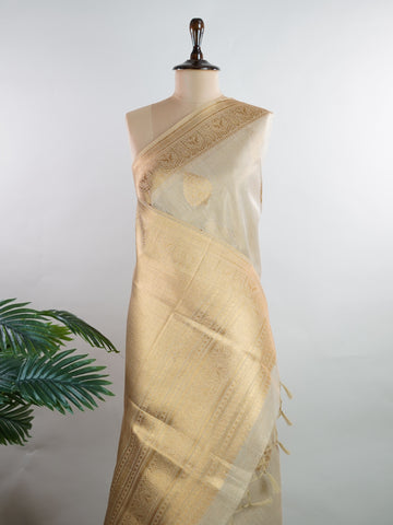 tissue This Kora Semi Tissue saree in rich gold features elegant stripes woven with fine zari. Lightweight and luminous, it captures the essence of festive finesse. Crafted in Varanasi, it drapes with ease and radiance. A timeless choice for celebrations with subtle grandeur. #KoraSemiTissue #GoldStripes #FineZari #VaranasiWeaves #ManoranjithamSarees Sharvani - Gold Semi Silk Saree - Manoranjitham Weaves - Handloom Store