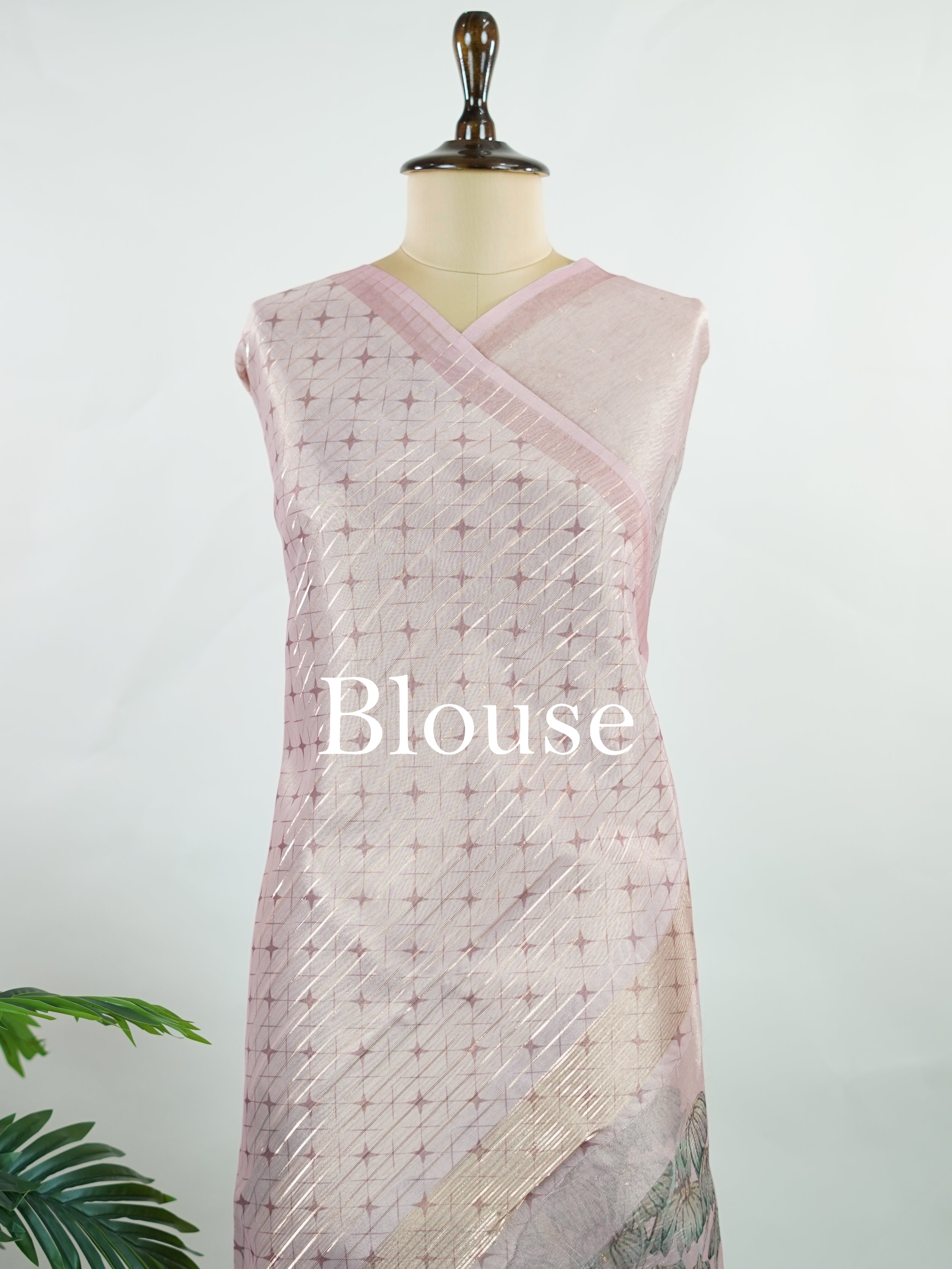 tissue A delicate Banaras Tissue saree woven in the heritage looms of Varanasi, this piece captures the timeless shimmer of fine zari work on a lightweight, translucent base. The luminous fabric drapes effortlessly and catches the light beautifully, making it an ideal choice for festive gatherings, pujas, and celebrations. Its airy texture keeps you comfortable while the subtle zari detailing adds a touch of understated elegance. tissue - Semi Silk Saree - Manoranjitham Weaves - Handloom Store