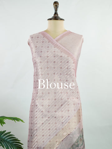 tissue A delicate Banaras Tissue saree woven in the heritage looms of Varanasi, this piece captures the timeless shimmer of fine zari work on a lightweight, translucent base. The luminous fabric drapes effortlessly and catches the light beautifully, making it an ideal choice for festive gatherings, pujas, and celebrations. Its airy texture keeps you comfortable while the subtle zari detailing adds a touch of understated elegance. tissue - Semi Silk Saree - Manoranjitham Weaves - Handloom Store