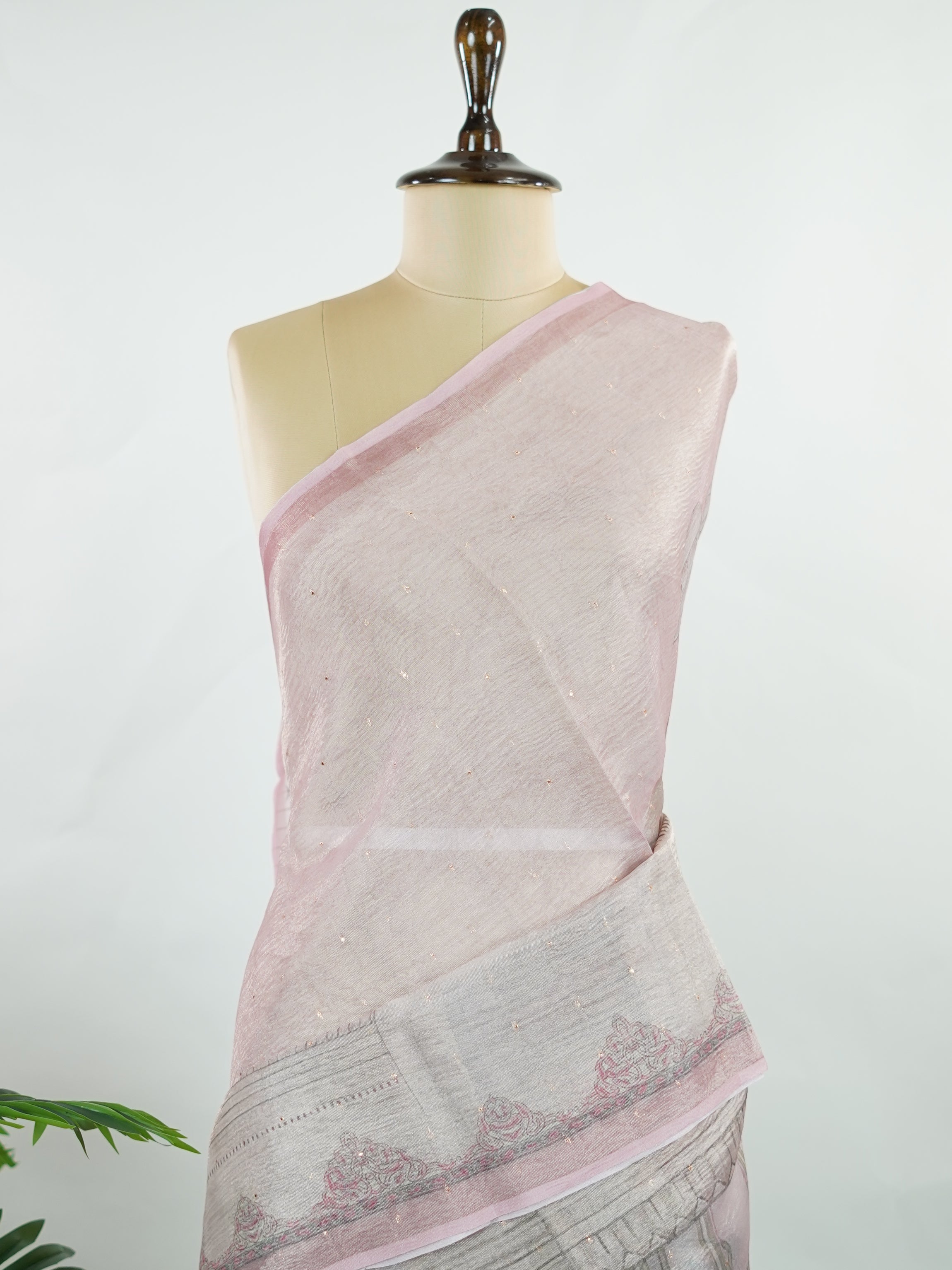tissue A delicate Banaras Tissue saree woven in the heritage looms of Varanasi, this piece captures the timeless shimmer of fine zari work on a lightweight, translucent base. The luminous fabric drapes effortlessly and catches the light beautifully, making it an ideal choice for festive gatherings, pujas, and celebrations. Its airy texture keeps you comfortable while the subtle zari detailing adds a touch of understated elegance. tissue - Semi Silk Saree - Manoranjitham Weaves - Handloom Store
