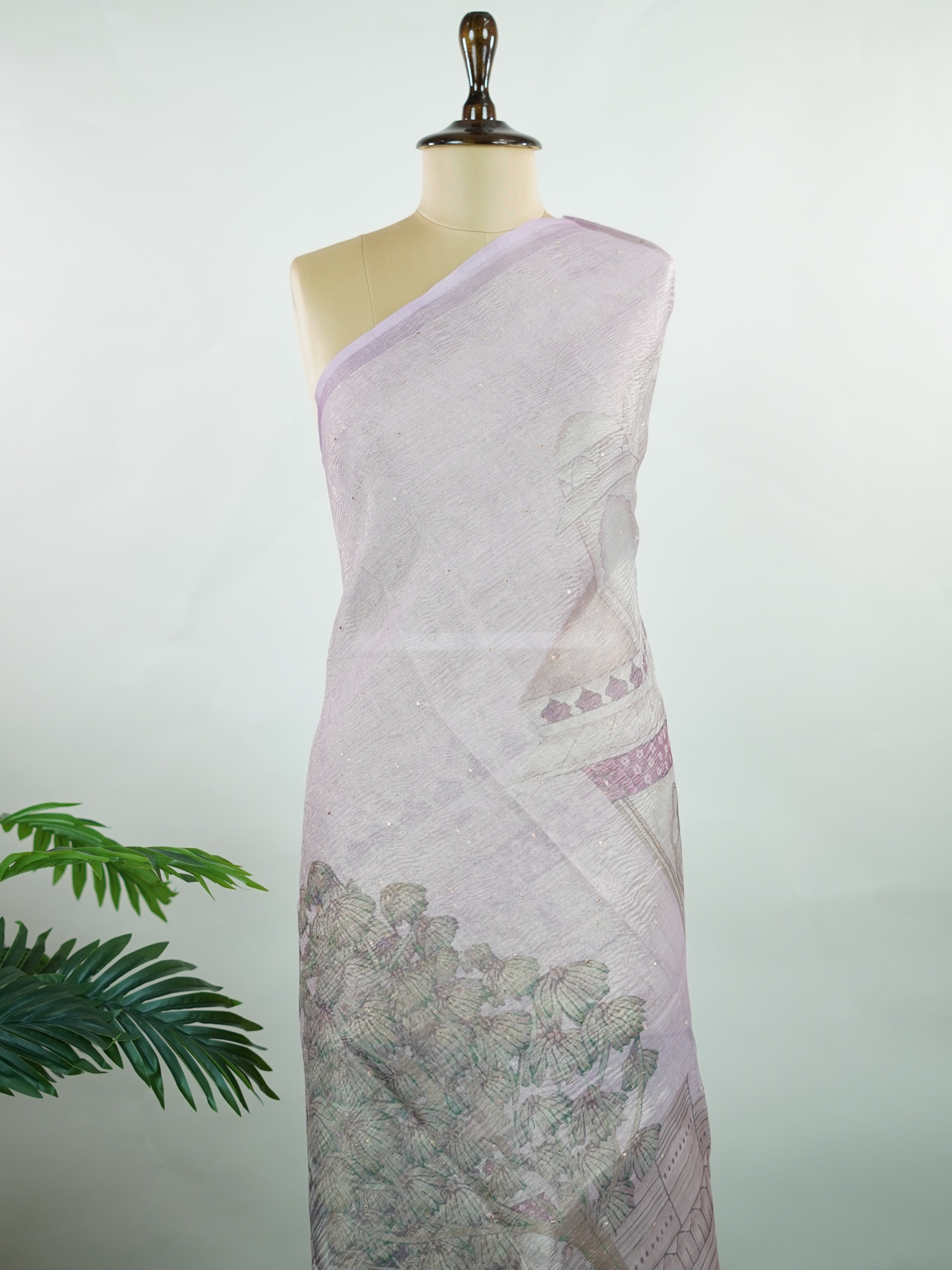 tissue A delicate Banaras Tissue saree woven in the heritage looms of Varanasi, this piece captures the timeless shimmer of fine zari work on a lightweight, translucent base. The luminous fabric drapes effortlessly and catches the light beautifully, making it an ideal choice for festive gatherings, pujas, and celebrations. Its airy texture keeps you comfortable while the subtle zari detailing adds a touch of understated elegance. tissue - Semi Silk Saree - Manoranjitham Weaves - Handloom Store