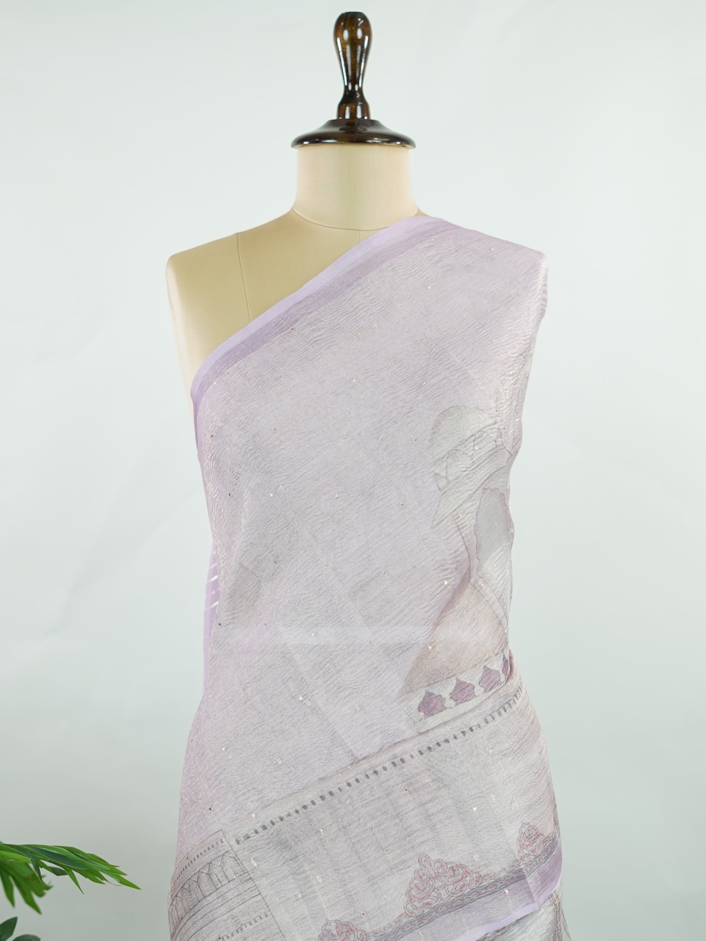 tissue A delicate Banaras Tissue saree woven in the heritage looms of Varanasi, this piece captures the timeless shimmer of fine zari work on a lightweight, translucent base. The luminous fabric drapes effortlessly and catches the light beautifully, making it an ideal choice for festive gatherings, pujas, and celebrations. Its airy texture keeps you comfortable while the subtle zari detailing adds a touch of understated elegance. tissue - Semi Silk Saree - Manoranjitham Weaves - Handloom Store