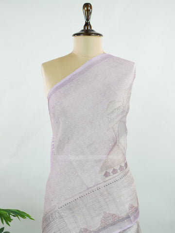 tissue A delicate Banaras Tissue saree woven in the heritage looms of Varanasi, this piece captures the timeless shimmer of fine zari work on a lightweight, translucent base. The luminous fabric drapes effortlessly and catches the light beautifully, making it an ideal choice for festive gatherings, pujas, and celebrations. Its airy texture keeps you comfortable while the subtle zari detailing adds a touch of understated elegance. tissue - Semi Silk Saree - Manoranjitham Weaves - Handloom Store