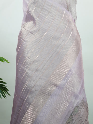 tissue A delicate Banaras Tissue saree woven in the heritage looms of Varanasi, this piece captures the timeless shimmer of fine zari work on a lightweight, translucent base. The luminous fabric drapes effortlessly and catches the light beautifully, making it an ideal choice for festive gatherings, pujas, and celebrations. Its airy texture keeps you comfortable while the subtle zari detailing adds a touch of understated elegance. tissue - Semi Silk Saree - Manoranjitham Weaves - Handloom Store