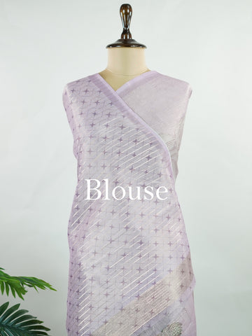 tissue A delicate Banaras Tissue saree woven in the heritage looms of Varanasi, this piece captures the timeless shimmer of fine zari work on a lightweight, translucent base. The luminous fabric drapes effortlessly and catches the light beautifully, making it an ideal choice for festive gatherings, pujas, and celebrations. Its airy texture keeps you comfortable while the subtle zari detailing adds a touch of understated elegance. tissue - Semi Silk Saree - Manoranjitham Weaves - Handloom Store