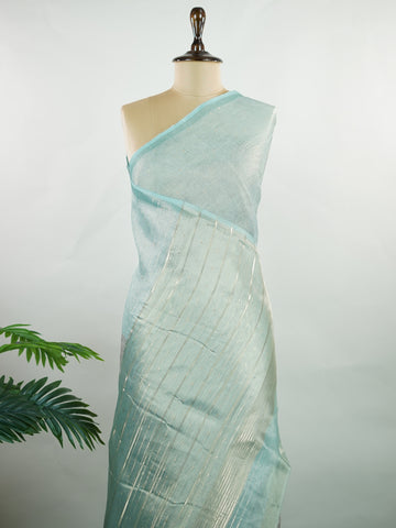 tissue A delicate Banaras Tissue saree woven in the heritage looms of Varanasi, this piece captures the timeless shimmer of fine zari work on a lightweight, translucent base. The luminous fabric drapes effortlessly and catches the light beautifully, making it an ideal choice for festive gatherings, pujas, and celebrations. Its airy texture keeps you comfortable while the subtle zari detailing adds a touch of understated elegance. tissue - Semi Silk Saree - Manoranjitham Weaves - Handloom Store