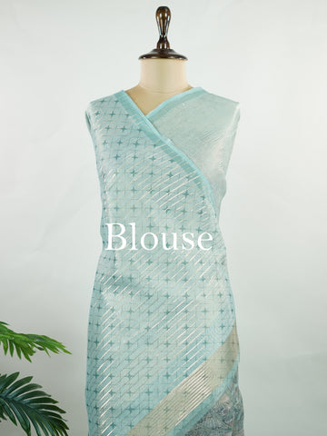 tissue A delicate Banaras Tissue saree woven in the heritage looms of Varanasi, this piece captures the timeless shimmer of fine zari work on a lightweight, translucent base. The luminous fabric drapes effortlessly and catches the light beautifully, making it an ideal choice for festive gatherings, pujas, and celebrations. Its airy texture keeps you comfortable while the subtle zari detailing adds a touch of understated elegance. tissue - Semi Silk Saree - Manoranjitham Weaves - Handloom Store