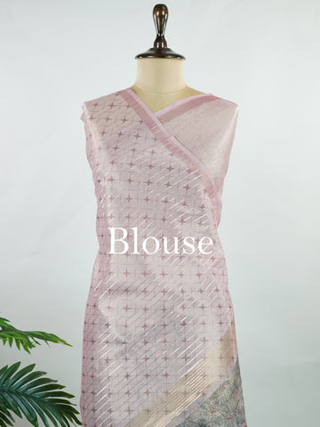 tissue A delicate Banaras Tissue saree woven in the heritage looms of Varanasi, this piece captures the timeless shimmer of fine zari work on a lightweight, translucent base. The luminous fabric drapes effortlessly and catches the light beautifully, making it an ideal choice for festive gatherings, pujas, and celebrations. Its airy texture keeps you comfortable while the subtle zari detailing adds a touch of understated elegance. tissue - Semi Silk Saree - Manoranjitham Weaves - Handloom Store