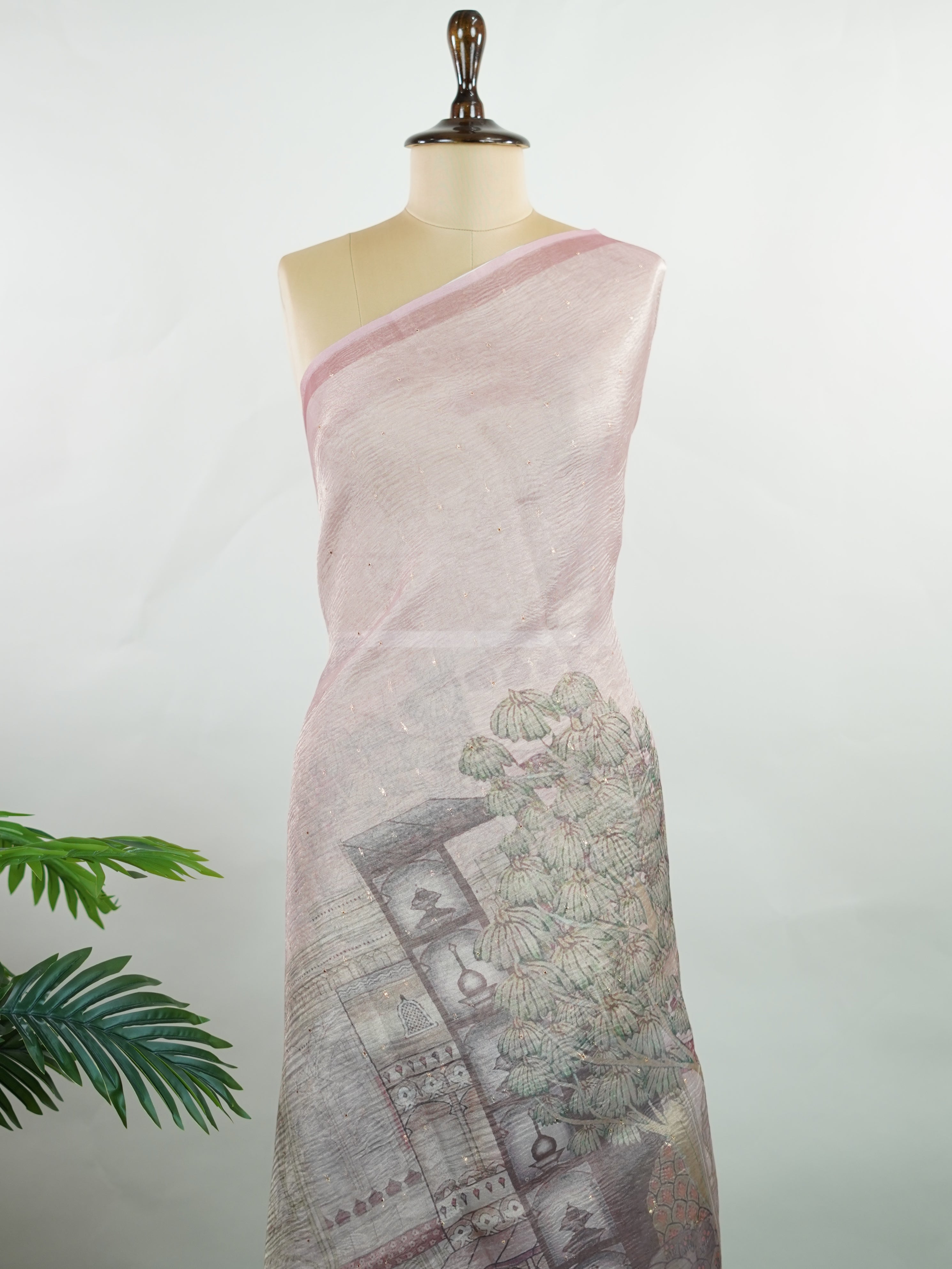 tissue A delicate Banaras Tissue saree woven in the heritage looms of Varanasi, this piece captures the timeless shimmer of fine zari work on a lightweight, translucent base. The luminous fabric drapes effortlessly and catches the light beautifully, making it an ideal choice for festive gatherings, pujas, and celebrations. Its airy texture keeps you comfortable while the subtle zari detailing adds a touch of understated elegance. tissue - Semi Silk Saree - Manoranjitham Weaves - Handloom Store