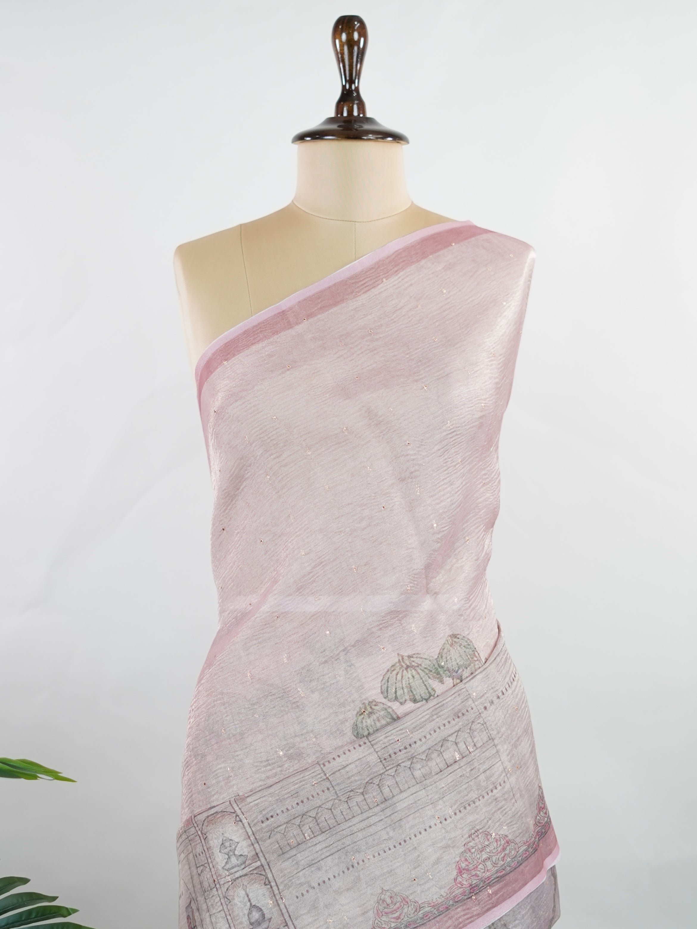 tissue A delicate Banaras Tissue saree woven in the heritage looms of Varanasi, this piece captures the timeless shimmer of fine zari work on a lightweight, translucent base. The luminous fabric drapes effortlessly and catches the light beautifully, making it an ideal choice for festive gatherings, pujas, and celebrations. Its airy texture keeps you comfortable while the subtle zari detailing adds a touch of understated elegance. tissue - Semi Silk Saree - Manoranjitham Weaves - Handloom Store