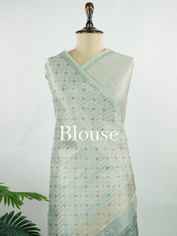 tissue A delicate Banaras Tissue saree woven in the heritage looms of Varanasi, this piece captures the timeless shimmer of fine zari work on a lightweight, translucent base. The luminous fabric drapes effortlessly and catches the light beautifully, making it an ideal choice for festive gatherings, pujas, and celebrations. Its airy texture keeps you comfortable while the subtle zari detailing adds a touch of understated elegance. tissue - Semi Silk Saree - Manoranjitham Weaves - Handloom Store