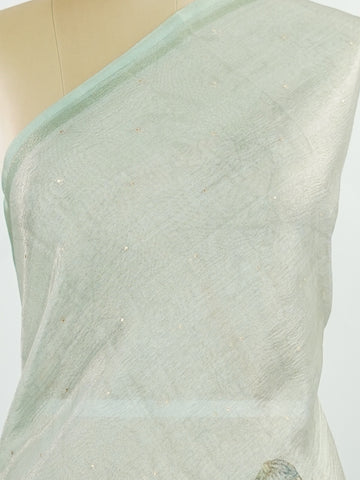 tissue A delicate Banaras Tissue saree woven in the heritage looms of Varanasi, this piece captures the timeless shimmer of fine zari work on a lightweight, translucent base. The luminous fabric drapes effortlessly and catches the light beautifully, making it an ideal choice for festive gatherings, pujas, and celebrations. Its airy texture keeps you comfortable while the subtle zari detailing adds a touch of understated elegance. tissue - Semi Silk Saree - Manoranjitham Weaves - Handloom Store