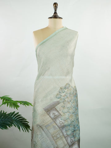 tissue A delicate Banaras Tissue saree woven in the heritage looms of Varanasi, this piece captures the timeless shimmer of fine zari work on a lightweight, translucent base. The luminous fabric drapes effortlessly and catches the light beautifully, making it an ideal choice for festive gatherings, pujas, and celebrations. Its airy texture keeps you comfortable while the subtle zari detailing adds a touch of understated elegance. tissue - Semi Silk Saree - Manoranjitham Weaves - Handloom Store