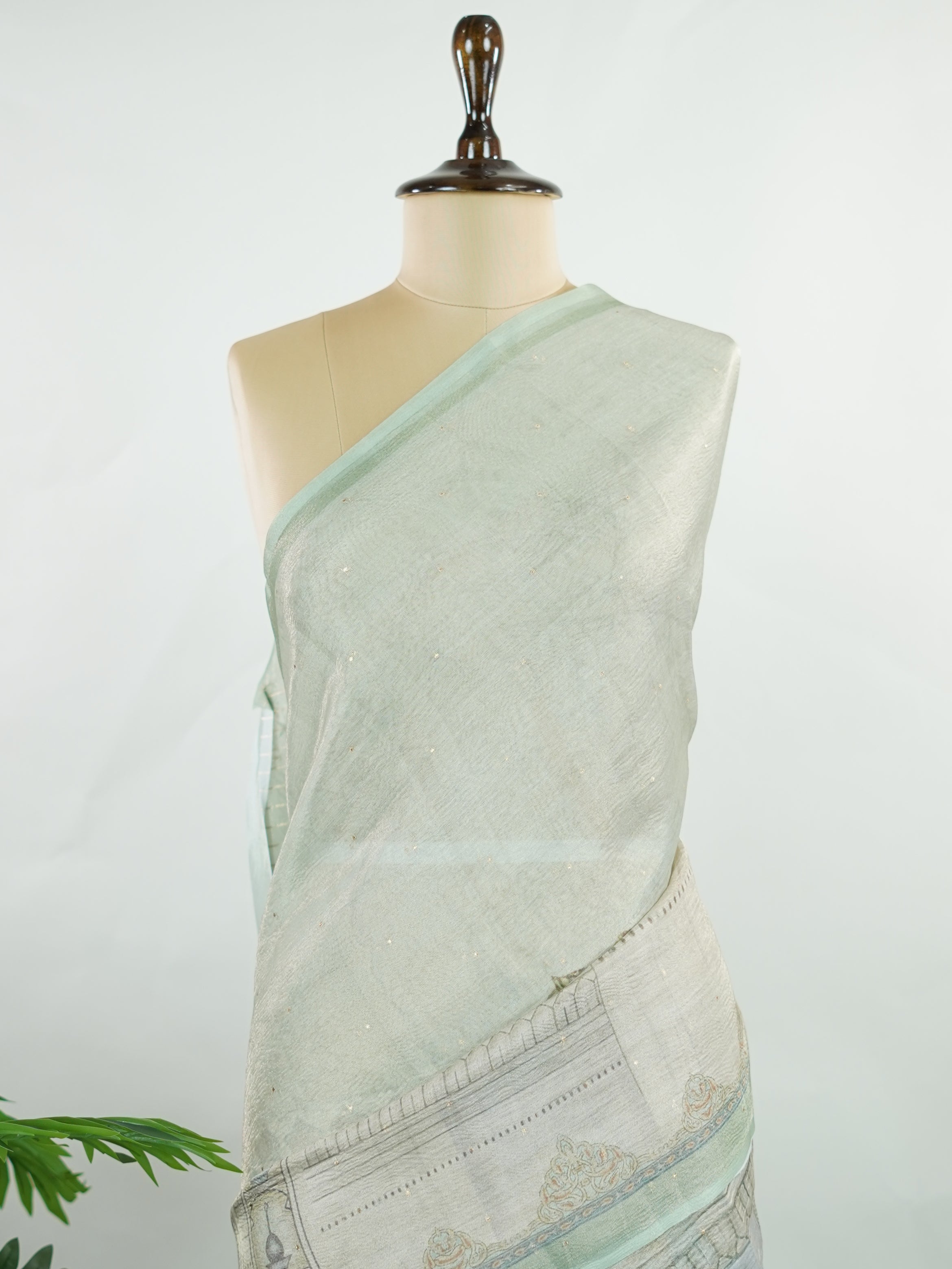 tissue A delicate Banaras Tissue saree woven in the heritage looms of Varanasi, this piece captures the timeless shimmer of fine zari work on a lightweight, translucent base. The luminous fabric drapes effortlessly and catches the light beautifully, making it an ideal choice for festive gatherings, pujas, and celebrations. Its airy texture keeps you comfortable while the subtle zari detailing adds a touch of understated elegance. tissue - Semi Silk Saree - Manoranjitham Weaves - Handloom Store
