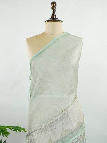 tissue A delicate Banaras Tissue saree woven in the heritage looms of Varanasi, this piece captures the timeless shimmer of fine zari work on a lightweight, translucent base. The luminous fabric drapes effortlessly and catches the light beautifully, making it an ideal choice for festive gatherings, pujas, and celebrations. Its airy texture keeps you comfortable while the subtle zari detailing adds a touch of understated elegance. tissue - Semi Silk Saree - Manoranjitham Weaves - Handloom Store