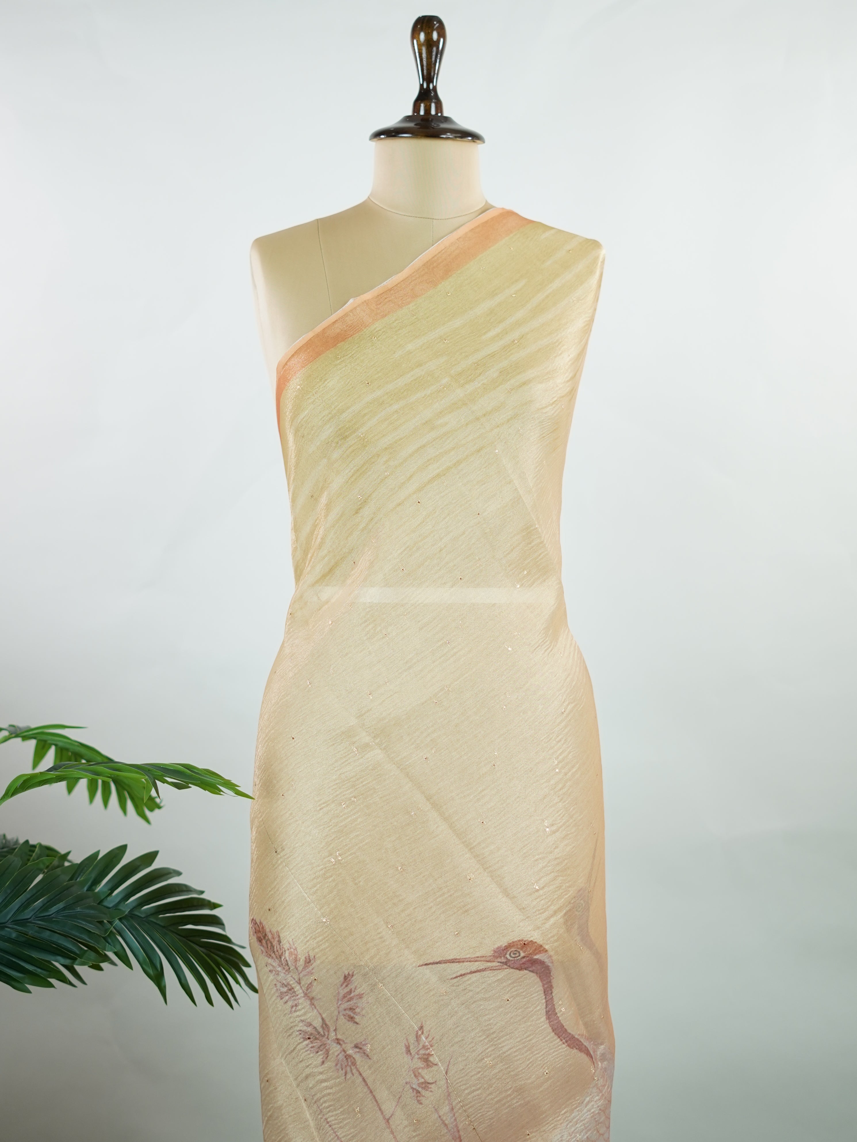 tissue This lightweight Semi Tissue saree from Varanasi blends the translucent beauty of tissue fabric with fine zari weave patterns that shimmer delicately across its surface. Its smooth drape and luminous finish make it a versatile choice for festive occasions, evening outings, and celebrations. A beautiful balance of traditional craftsmanship and contemporary wearability. Semi Tissue - Semi Silk Saree - Manoranjitham Weaves - Handloom Store
