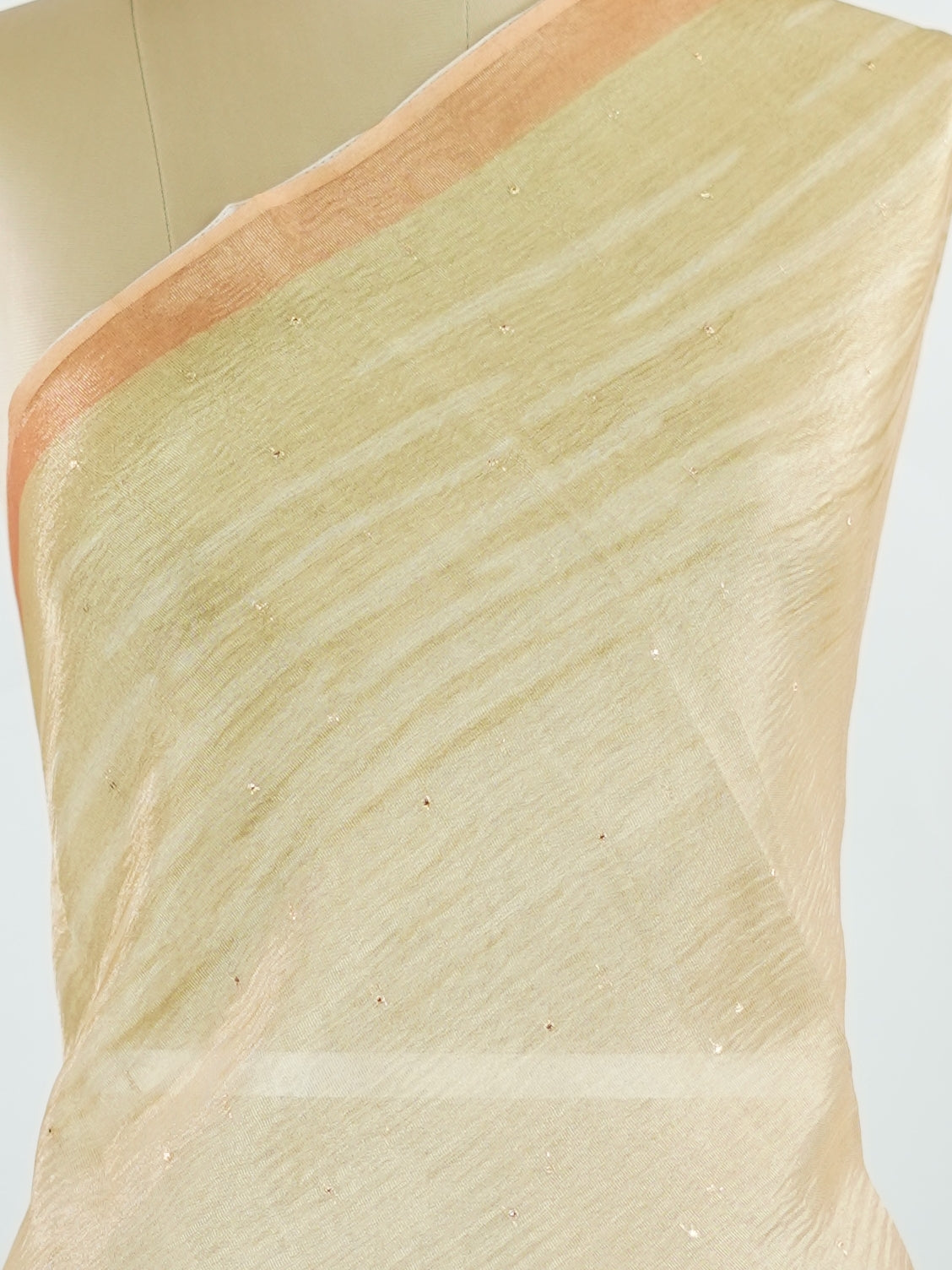tissue This lightweight Semi Tissue saree from Varanasi blends the translucent beauty of tissue fabric with fine zari weave patterns that shimmer delicately across its surface. Its smooth drape and luminous finish make it a versatile choice for festive occasions, evening outings, and celebrations. A beautiful balance of traditional craftsmanship and contemporary wearability. Semi Tissue - Semi Silk Saree - Manoranjitham Weaves - Handloom Store