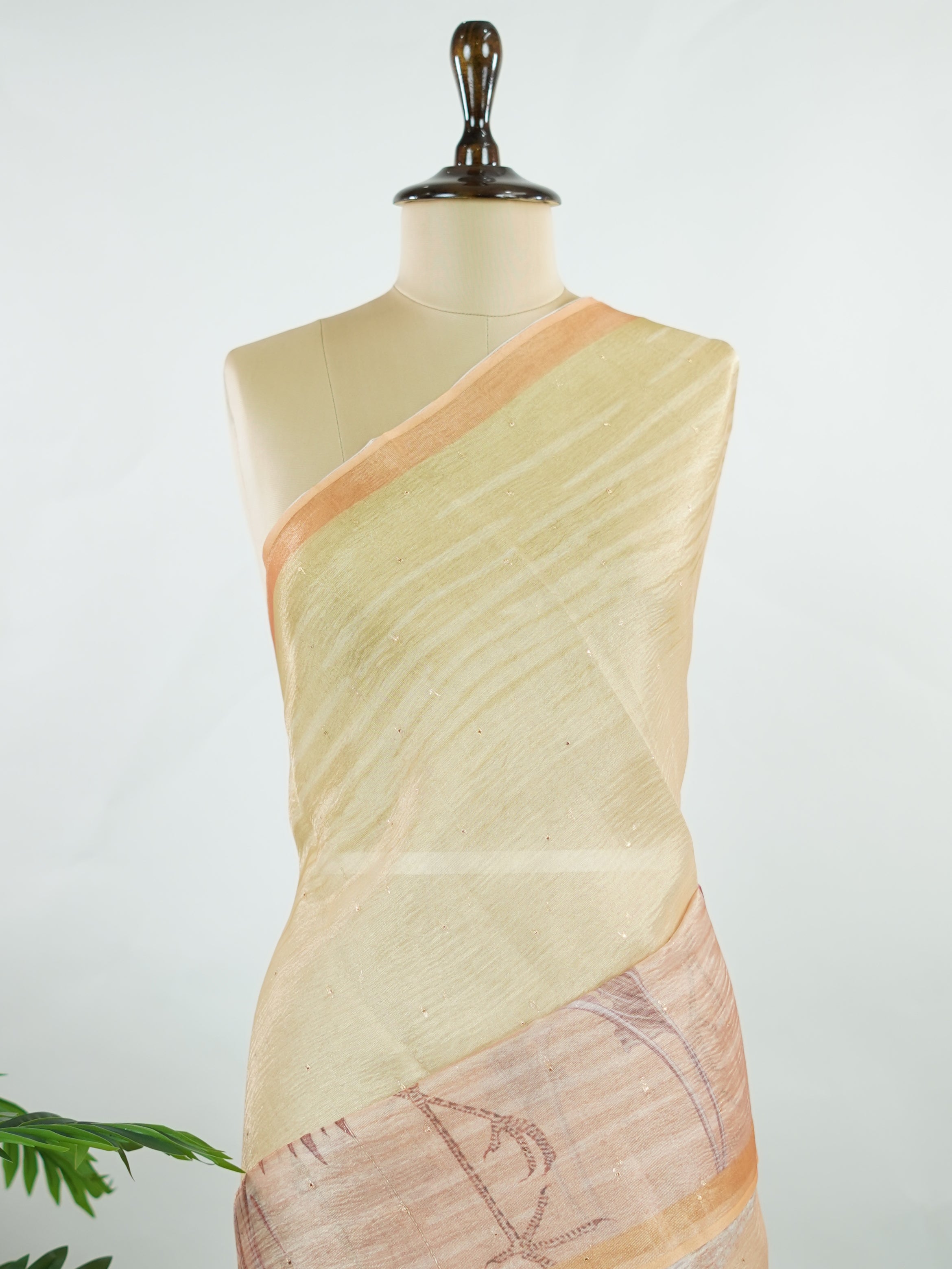 tissue This lightweight Semi Tissue saree from Varanasi blends the translucent beauty of tissue fabric with fine zari weave patterns that shimmer delicately across its surface. Its smooth drape and luminous finish make it a versatile choice for festive occasions, evening outings, and celebrations. A beautiful balance of traditional craftsmanship and contemporary wearability. Semi Tissue - Semi Silk Saree - Manoranjitham Weaves - Handloom Store