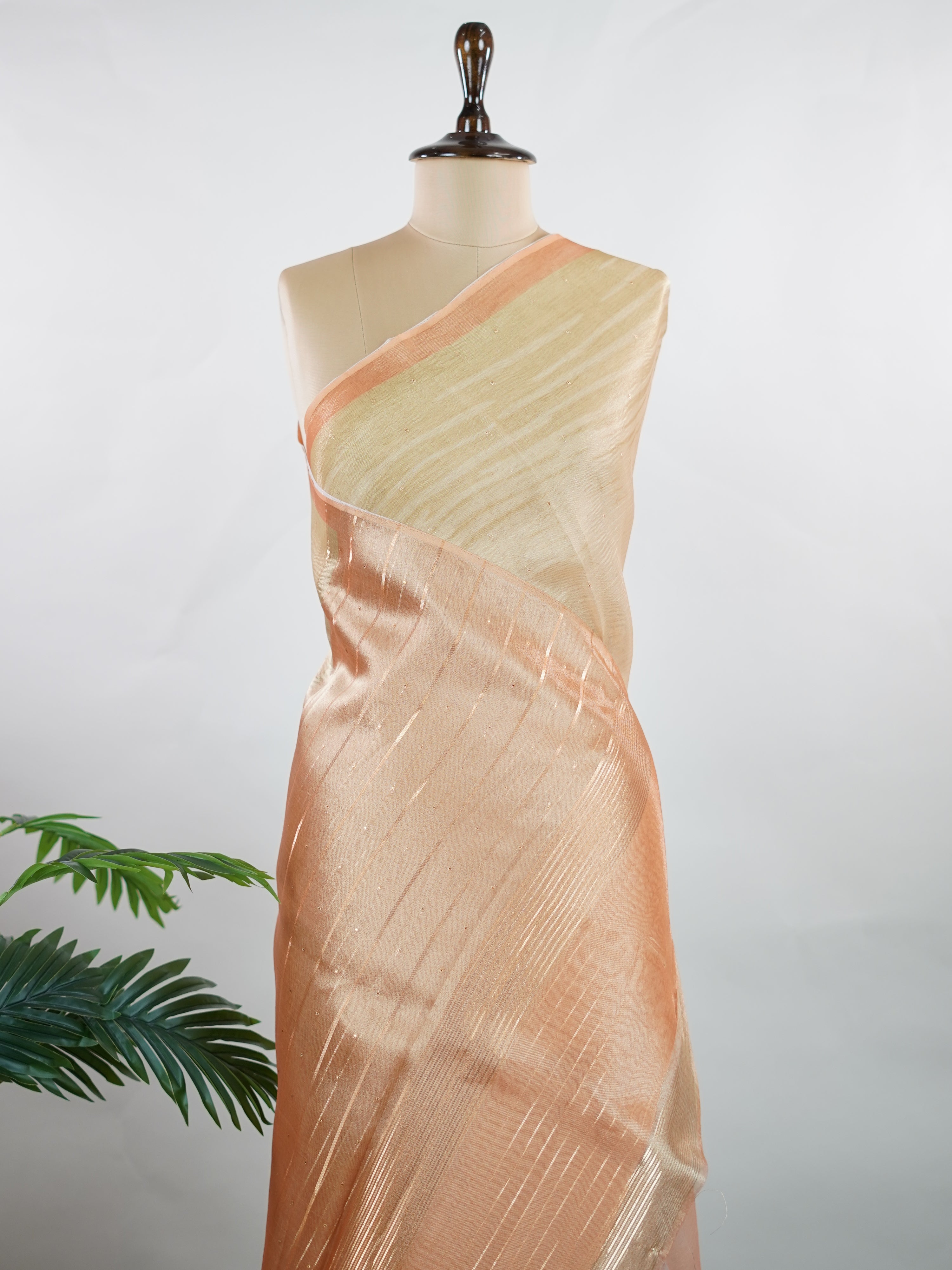 tissue This lightweight Semi Tissue saree from Varanasi blends the translucent beauty of tissue fabric with fine zari weave patterns that shimmer delicately across its surface. Its smooth drape and luminous finish make it a versatile choice for festive occasions, evening outings, and celebrations. A beautiful balance of traditional craftsmanship and contemporary wearability. Semi Tissue - Semi Silk Saree - Manoranjitham Weaves - Handloom Store