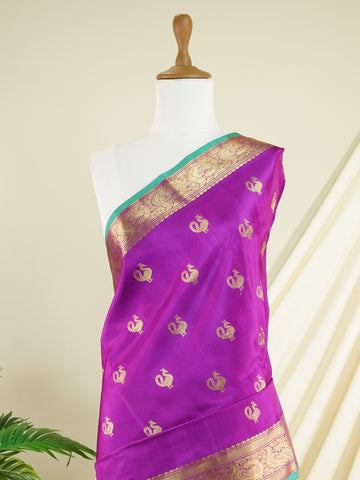 Venkatagiri Silk A masterpiece from Venkatagiri, this 100% Pure Silk  saree in Magenta is a tribute to India's rich handloom legacy. The Pure Zari weaving and Buttis motifs make it a perfect choice for brides and celebrations. Every thread speaks of elegance, tradition, and the skilled hands that bring this saree to life. Miyan Malhara     - Manoranjitham Weaves - Handloom Store