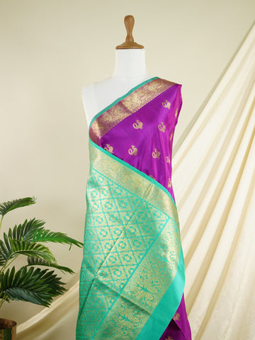 Venkatagiri Silk A masterpiece from Venkatagiri, this 100% Pure Silk  saree in Magenta is a tribute to India's rich handloom legacy. The Pure Zari weaving and Buttis motifs make it a perfect choice for brides and celebrations. Every thread speaks of elegance, tradition, and the skilled hands that bring this saree to life. Miyan Malhara     - Manoranjitham Weaves - Handloom Store