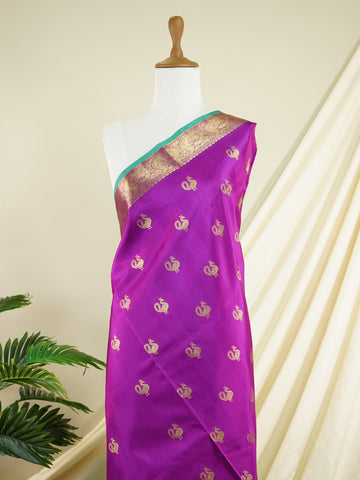 Venkatagiri Silk A masterpiece from Venkatagiri, this 100% Pure Silk  saree in Magenta is a tribute to India's rich handloom legacy. The Pure Zari weaving and Buttis motifs make it a perfect choice for brides and celebrations. Every thread speaks of elegance, tradition, and the skilled hands that bring this saree to life. Miyan Malhara     - Manoranjitham Weaves - Handloom Store