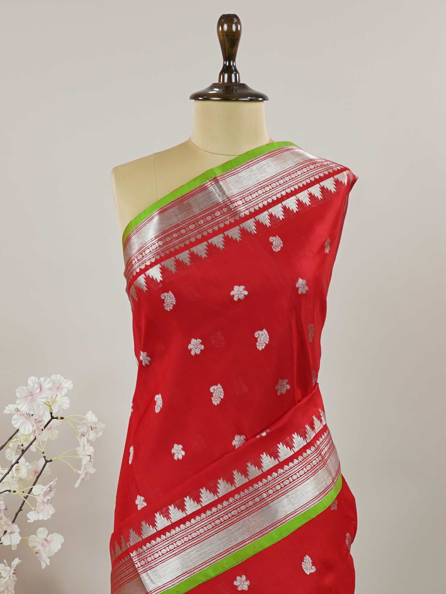 Venkatagiri Silk This 100% Pure Silk  silk saree, adorned in Red and detailed with Pure Zari weaving, reflects the grandeur of Venkatagiri. The timeless Buttis motifs enhance its bridal charm. A perfect blend of luxury and tradition, it is designed for those who appreciate fine craftsmanship. Patdeepa - Red Venkatagiri Pure Silk Saree - Manoranjitham Weaves - Handloom Store
