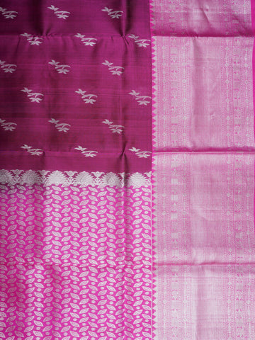 Venkatagiri Silk This 100% Pure Silk  silk saree, adorned in Maroon Pink and detailed with Pure Zari weaving, reflects the grandeur of Venkatagiri. The timeless Buttis motifs enhance its bridal charm. A perfect blend of luxury and tradition, it is designed for those who appreciate fine craftsmanship. Jaunpuri - Manoranjitham Weaves - Handloom Store