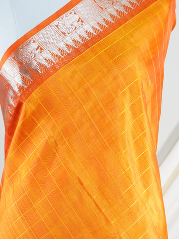 Venkatagiri Silk This 100% Pure Silk  silk saree, adorned in Coral and detailed with Pure Zari weaving, reflects the grandeur of Venkatagiri. The timeless Buttis motifs enhance its bridal charm. A perfect blend of luxury and tradition, it is designed for those who appreciate fine craftsmanship. Gaud Sarang - Manoranjitham Weaves - Handloom Store