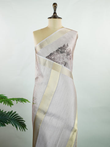 Kora This sheer Kora saree, crafted on powerlooms in Varanasi, is a celebration of lightness and elegance. Its translucent base is adorned with delicate gold zari work, weaving graceful patterns that shimmer with every movement. Ideal for summer festivities, daytime celebrations, and casual occasions, this saree offers a breezy, effortless drape with a refined traditional touch. Kora - Handloom Pure Silk Saree - Manoranjitham Weaves - Handloom Store