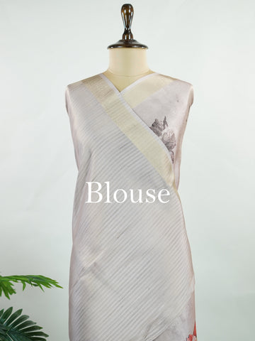 Kora This sheer Kora saree, crafted on powerlooms in Varanasi, is a celebration of lightness and elegance. Its translucent base is adorned with delicate gold zari work, weaving graceful patterns that shimmer with every movement. Ideal for summer festivities, daytime celebrations, and casual occasions, this saree offers a breezy, effortless drape with a refined traditional touch. Kora - Handloom Pure Silk Saree - Manoranjitham Weaves - Handloom Store