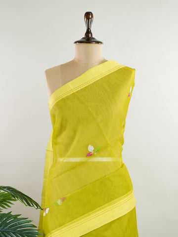 Cotton Woven with care in the looms of West Bengal, this 100% pure cotton saree blends everyday comfort with understated elegance. Fine zari floral designs shimmer softly against the breathable fabric, while the small border adds a touch of refinement. Lightweight and timeless, it’s perfect for summer gatherings and quiet celebrations Todi - Handloom Cotton Saree - Manoranjitham Weaves - Handloom Store