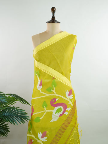 Cotton Woven with care in the looms of West Bengal, this 100% pure cotton saree blends everyday comfort with understated elegance. Fine zari floral designs shimmer softly against the breathable fabric, while the small border adds a touch of refinement. Lightweight and timeless, it’s perfect for summer gatherings and quiet celebrations Todi - Handloom Cotton Saree - Manoranjitham Weaves - Handloom Store