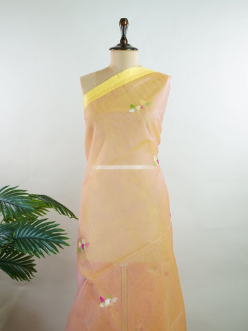 Cotton Woven with care in the looms of West Bengal, this 100% pure cotton saree blends everyday comfort with understated elegance. Fine zari floral designs shimmer softly against the breathable fabric, while the small border adds a touch of refinement. Lightweight and timeless, it’s perfect for summer gatherings and quiet celebrations Vyasa - Handloom Cotton Saree - Manoranjitham Weaves - Handloom Store