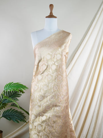 Katan A Tissue saree is the perfect blend of delicate silk and shimmering zari, woven to create an ethereal, translucent fabric that sparkles with every movement. Lightweight and luxurious, it’s ideal for grand occasions and celebrations where elegance is key. Draped in a Tissue saree, you embody timeless glamour with a modern twist. Avyaktha - Banarasi Tissue Kora Saree - Manoranjitham Weaves - Handloom Store