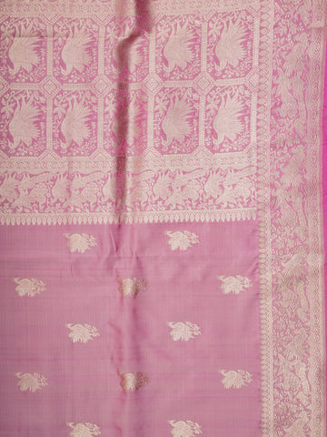 Katan Rathi, named after the vibrant rathi flower, is a full jaal Katan silk saree that showcases a brilliant blend of colors, enhancing your charm. This beautiful piece features intricate patterns woven into the fabric, evoking the essence of blooming flora. Adorned with pure zari detailing and exquisite handwork, it is perfect for celebrations and cultural events. Embrace the tradition of Varanasi weaving with Rathi, a timeless masterpiece of elegance. Rathi  - Manoranjitham Weaves - Handloom Store