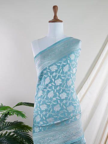 Katan Woven in the heart of Varanasi, this georgette saree features an intricate all-over jaal that glistens across its fluid, lightweight fabric. Elegant and ethereal, it brings together tradition and ease—ideal for evening celebrations and graceful occasions.br
#GeorgetteSaree #JaalWork #VaranasiWeaves #EtherealElegance #HandloomGrace #Manoranjitham #ManoranjithamStyle Pallavi - Georgette Saree | Full Jaal Zari - Manoranjitham Weaves - Handloom Store