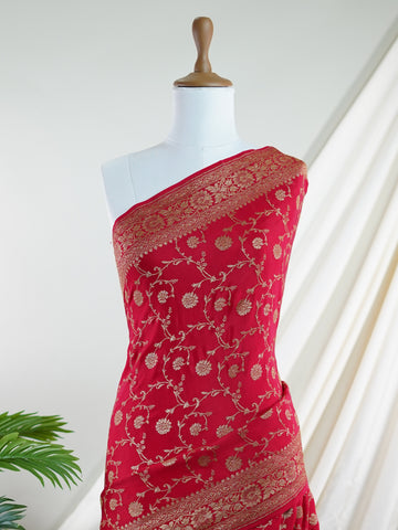 Crepe In bold red and radiant gold, this 100% pure crepe saree from Varanasi is adorned with delicate floral motifs. The soft drape and intricate weave bring together grace and grandeur in perfect harmony. A timeless piece for weddings, rituals, and every cherished celebration.br
#RedAndGoldSaree #VaranasiWeave #PureCrepeElegance #FloralHeritage #HandloomStories Jayantashree - Red Pure Banarasi Silk Saree | Woven Jaal - Manoranjitham Weaves - Handloom Store