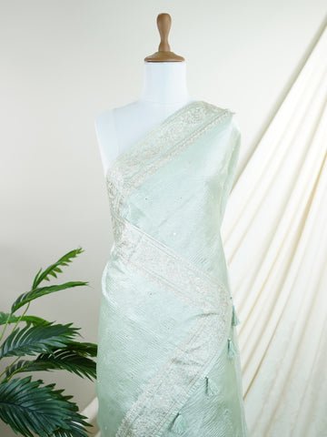 Tissue This semi-crush tissue saree from Varanasi radiates subtle elegance with its fine zari detailing and delicate embroidery. The fluid drape and medium weight lend it a graceful fall, ideal for refined gatherings and celebrations. A powerloom weave crafted with care, it offers timeless appeal in every pleat. Kiravani - Semi Silk Saree - Manoranjitham Weaves - Handloom Store