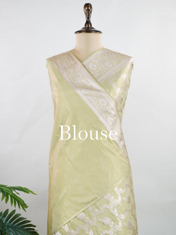 Semi Silk In a lush green hue with fine gold zari jaal, this semi tissue saree from Varanasi shimmers with understated grandeur. The delicate weave and sheer finish create a light yet festive drape—perfect for elegant rituals and serene celebrations.br
#SemiTissueSaree #FineZariWeave #GreenAndGold #VaranasiElegance #HandloomHeritage #Manoranjitham #ManoranjithamStyle Nayana - Semi Silk Saree | Full Jaal Zari - Manoranjitham Weaves - Handloom Store