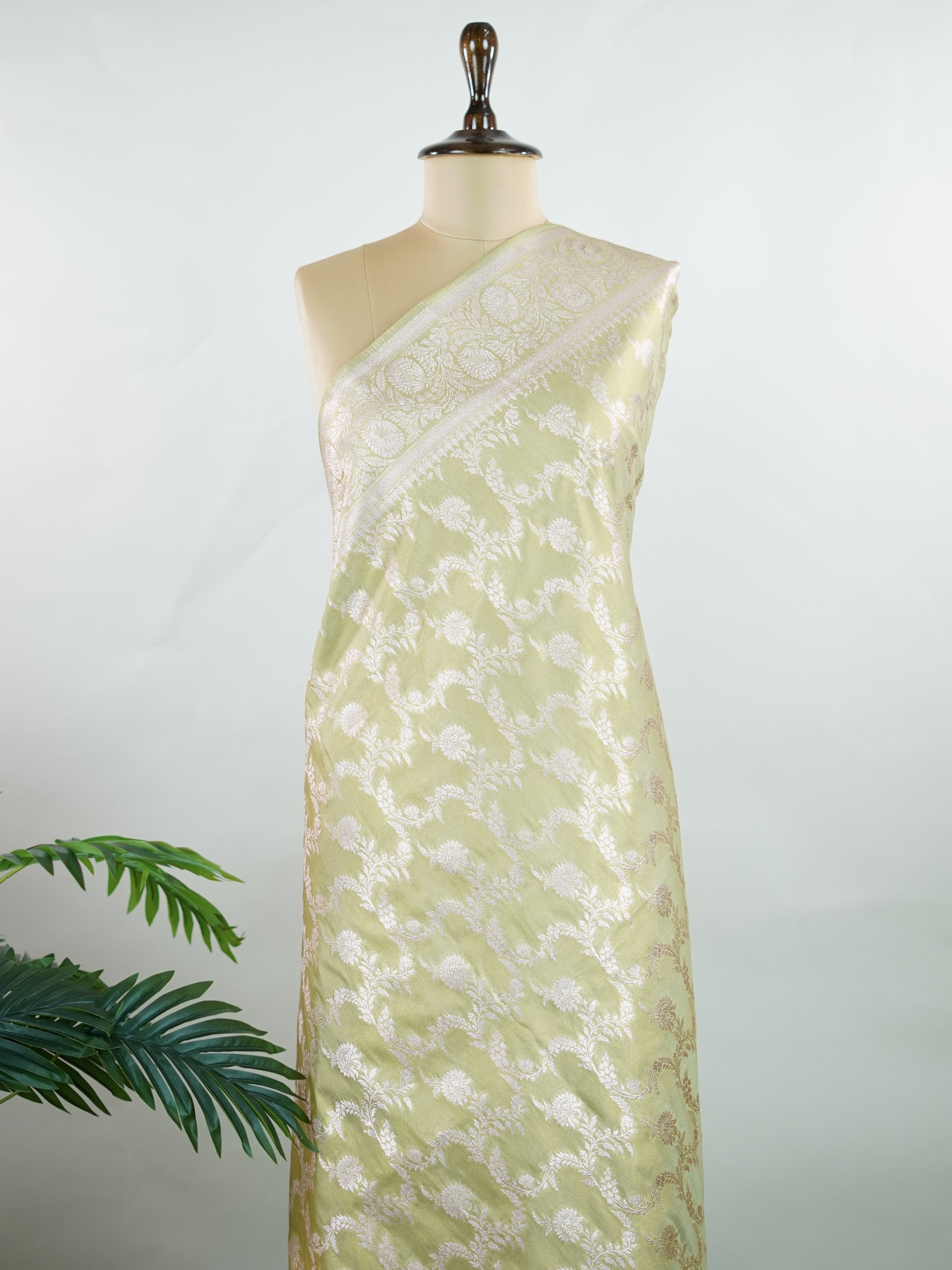 Semi Silk In a lush green hue with fine gold zari jaal, this semi tissue saree from Varanasi shimmers with understated grandeur. The delicate weave and sheer finish create a light yet festive drape—perfect for elegant rituals and serene celebrations.br
#SemiTissueSaree #FineZariWeave #GreenAndGold #VaranasiElegance #HandloomHeritage #Manoranjitham #ManoranjithamStyle Nayana - Semi Silk Saree | Full Jaal Zari - Manoranjitham Weaves - Handloom Store
