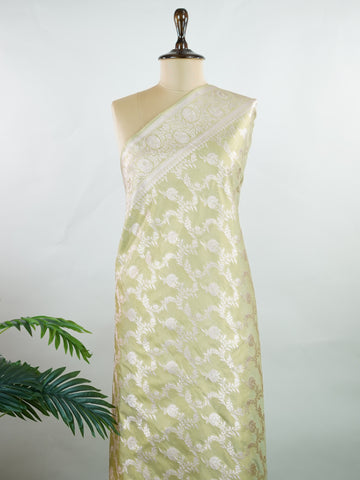Semi Silk In a lush green hue with fine gold zari jaal, this semi tissue saree from Varanasi shimmers with understated grandeur. The delicate weave and sheer finish create a light yet festive drape—perfect for elegant rituals and serene celebrations.br
#SemiTissueSaree #FineZariWeave #GreenAndGold #VaranasiElegance #HandloomHeritage #Manoranjitham #ManoranjithamStyle Nayana - Semi Silk Saree | Full Jaal Zari - Manoranjitham Weaves - Handloom Store
